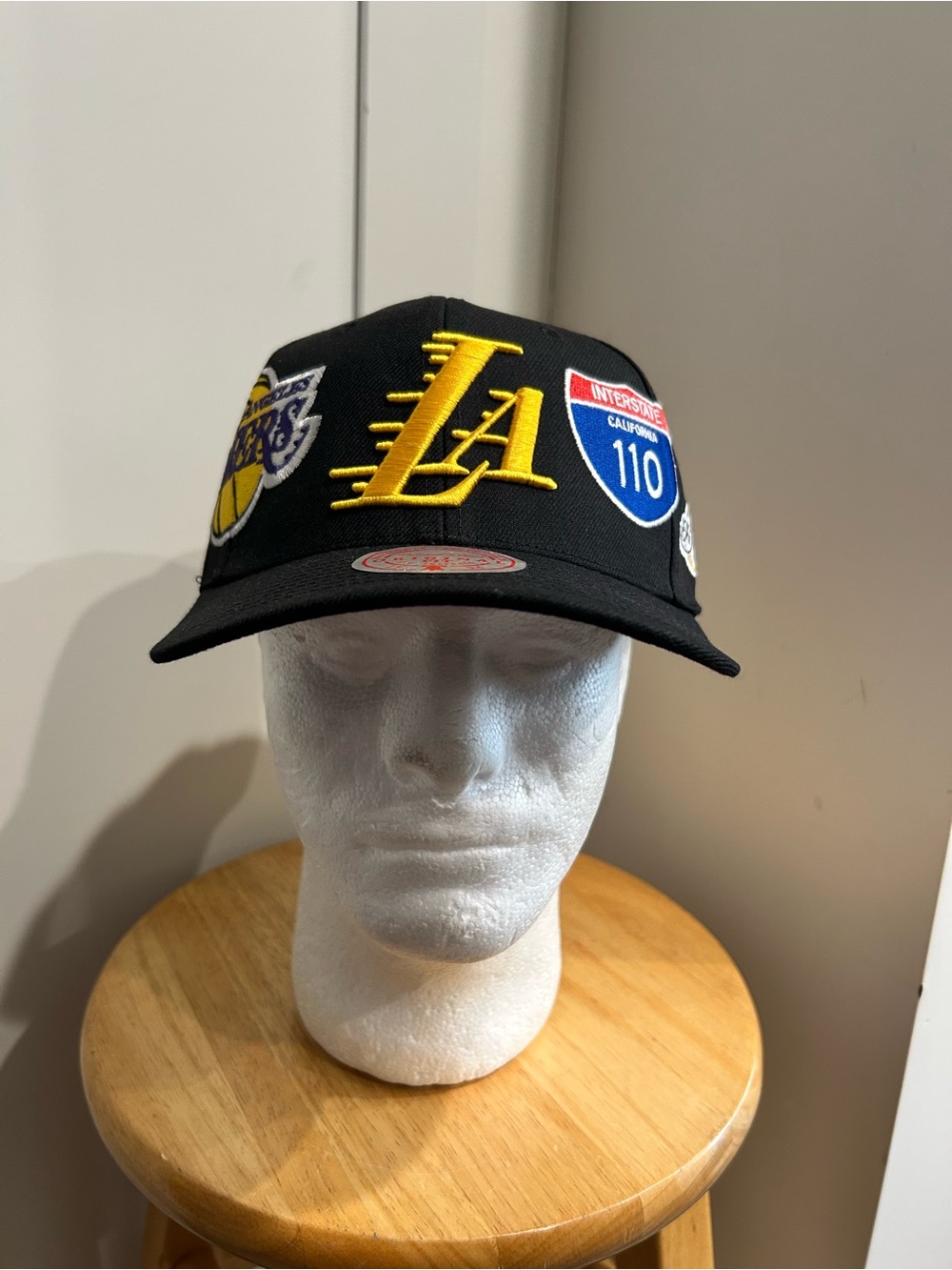 Mitchell & Ness Black LA Patch Snapback Cap with Yellow Embroidered Logo